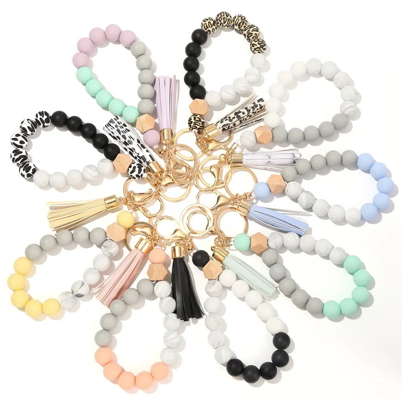 wholesale New Food Grade Silicone Wooden Beads Wristlet Bracelet Pu Tassel Design Anti Lost Car Key Chain Holder