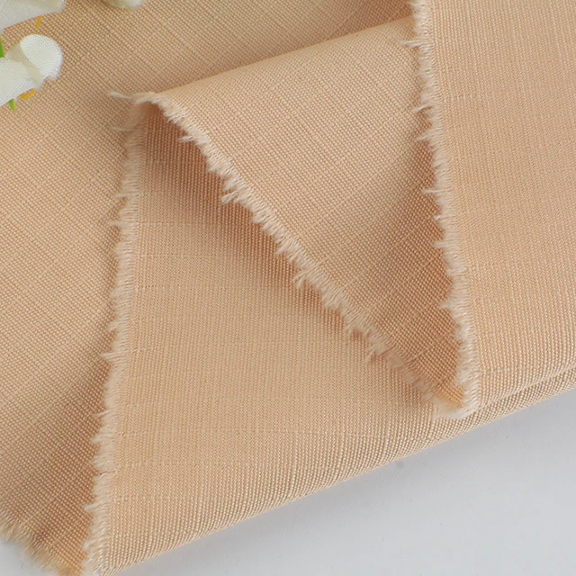 Wholesale plain-dyed woven thick strand beaded canvas lattice 100% cotton fabric for coat pants bags