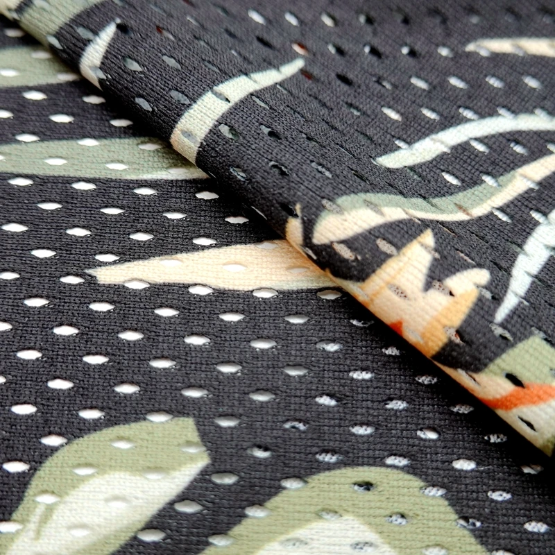 Breathable 100% polyester wrap knit custom leaf printed 130GSM eyelet sports mesh fabric for basketball tshirt