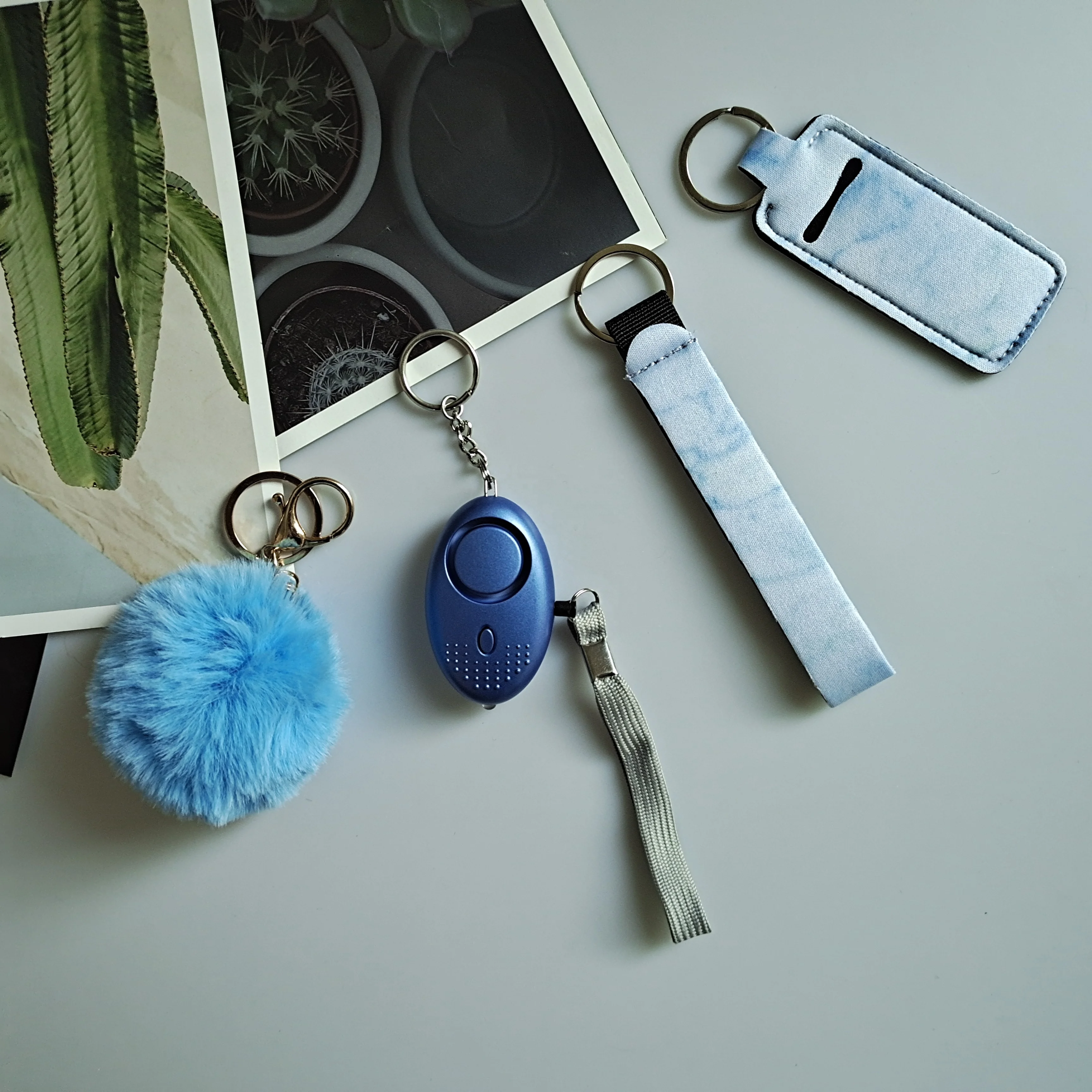 
New Fashion Pom Pom Lip Chapstick Holder Wristlet with LED Alarm Keychain Self Defence Products Set For Women 