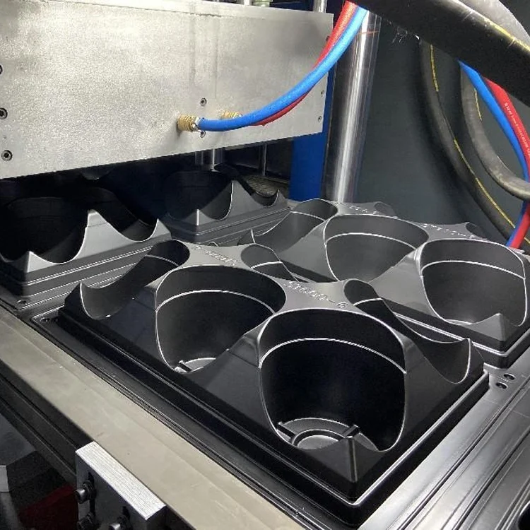 Multi station thermoforming machine for thermoforming tableware products