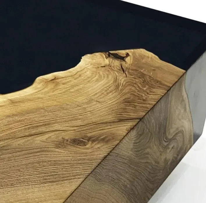 The solid wood coffee table with contemporary cube black wood grain is creatively placed in the living room and office