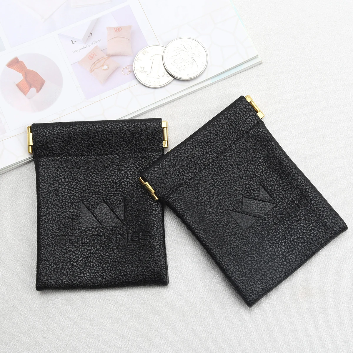 Custom Emboss Logo Reusable PU Leather Black Bag For Bluetooth Headset Packaging Shrapnel Openings Leather Dust Pouch