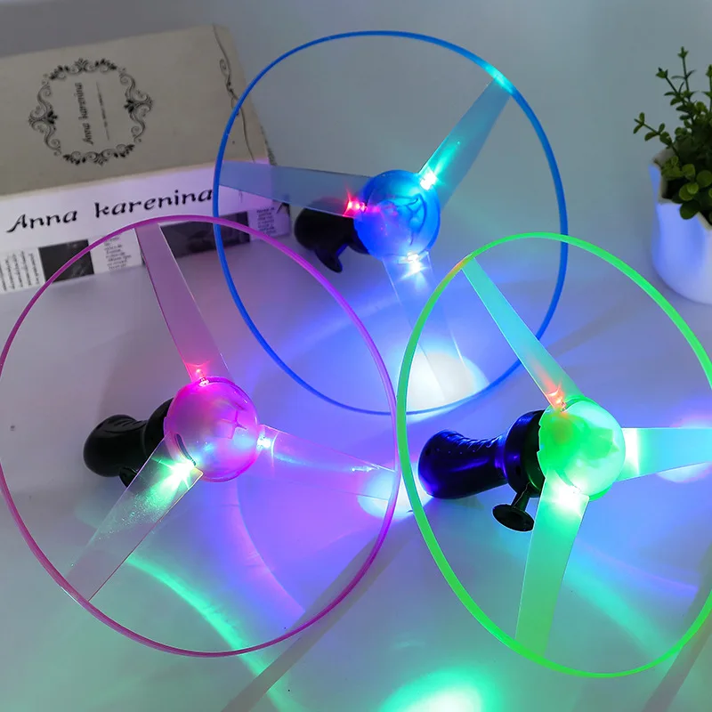 Funny plastic hand rotation push led light flying saucer outdoor toys pull line light up flying saucer toy