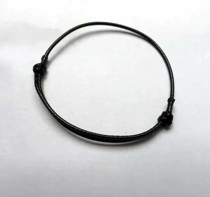 Bracelet multi strings  with braid and medallion, waxed, black polyester rope