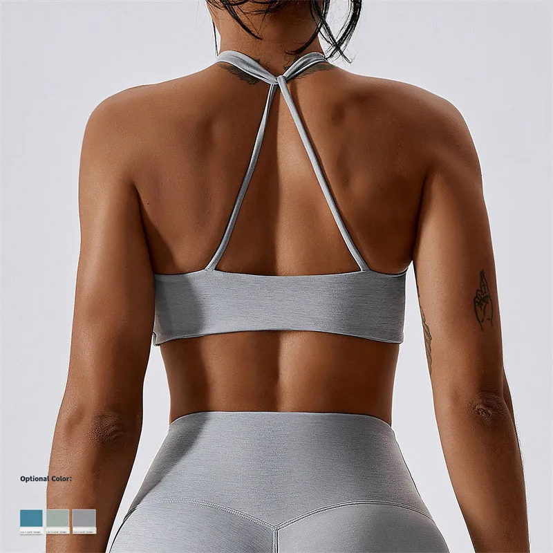OEM Sportswear Custom Logo New Arrival Women Padded Nude Yoga Hanging Neck Twisted  Bra Fitness Sexy Blank Sports Bra For Women