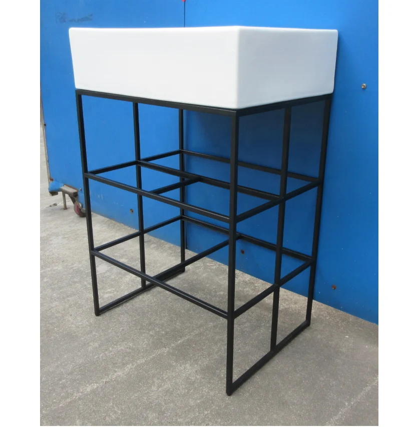 Steel and hampered copper apron bathroom vanity bases Carrara marble counter top  black round tubing washstand floating sink leg