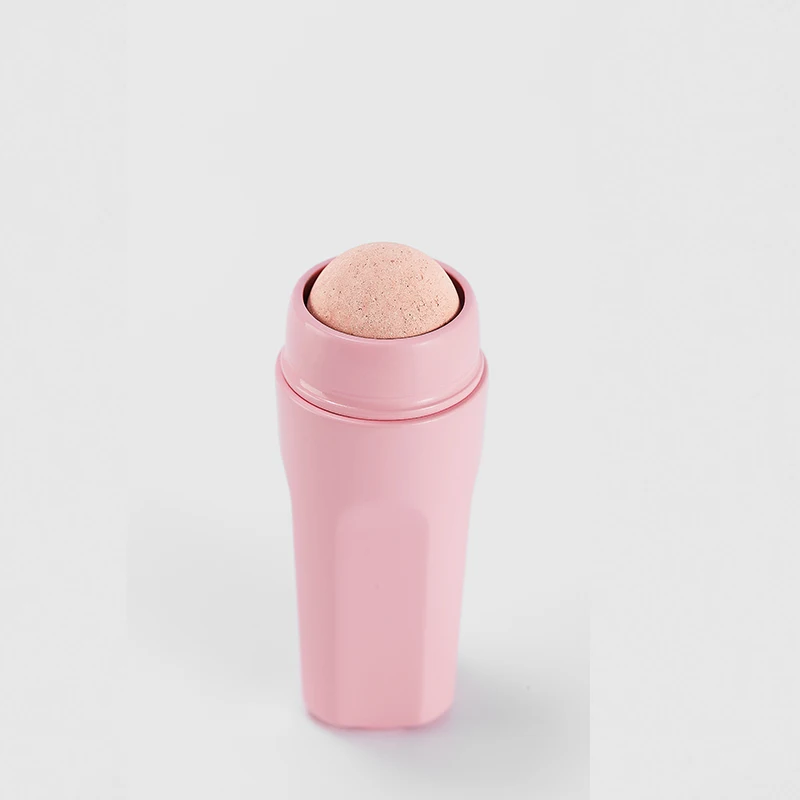 Trendy oil-absorbing volcanic stone face roller cosmetic tool customized logo color volcanic rock oil absorbing roller pink