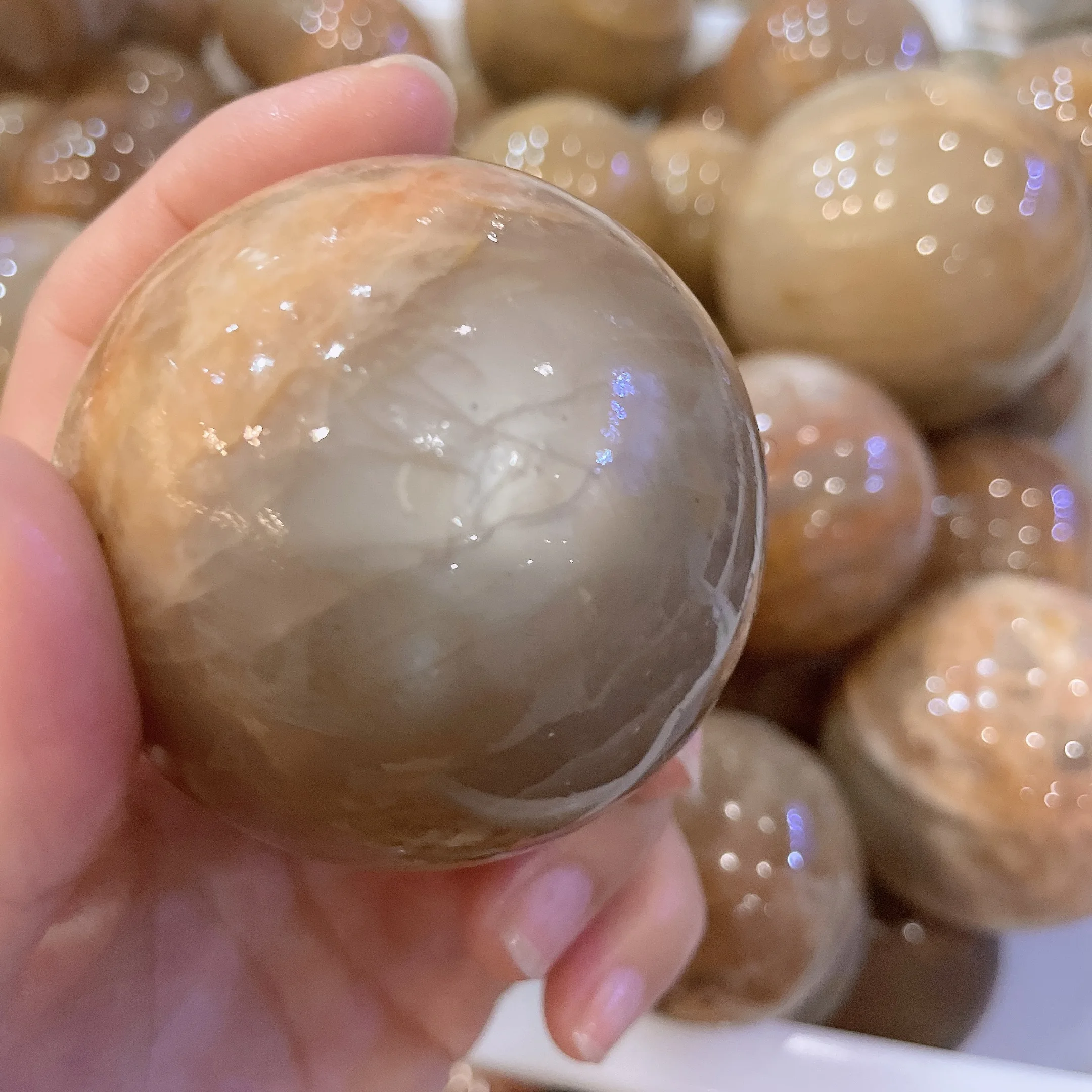 Wholesale high quality peach moonstone sphere  crystal quartz orange moonstone with flashy healing balls for homedecoratio