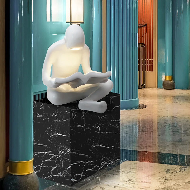 
Figurine manufacturers kid reading human sculpture for library 