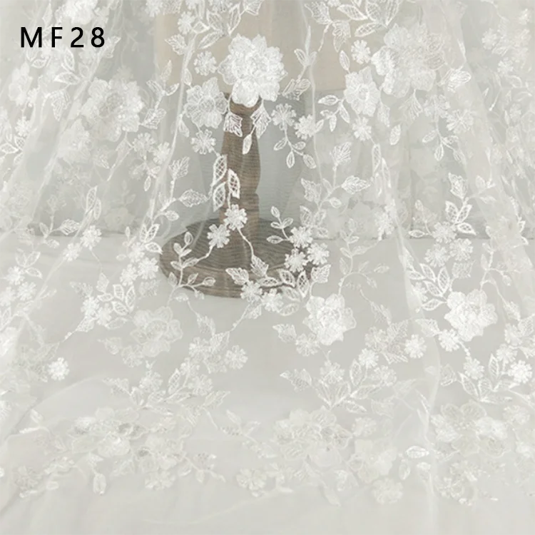 Wholesale luxury white  embroidery  mesh lace  fabric for fashion wedding dress