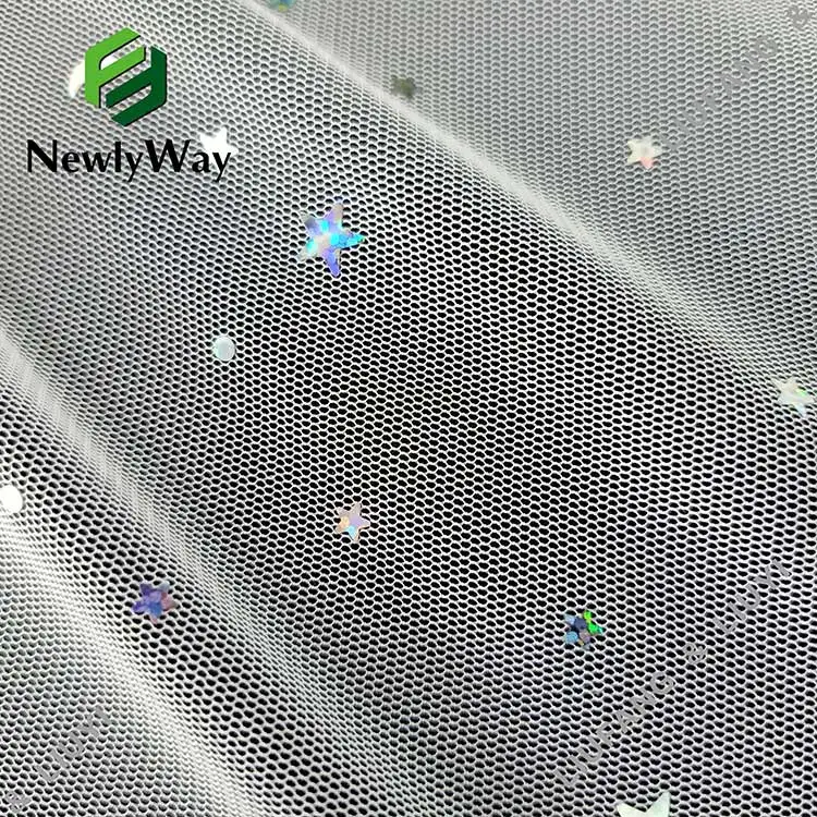 Bright sequin tulle fabric of stars and moons for the fairy skirt