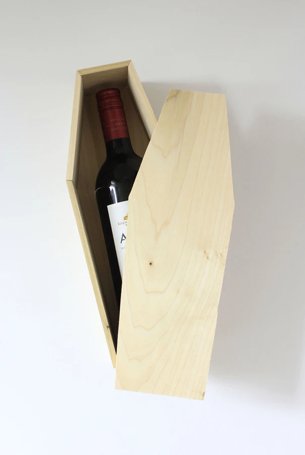 DIY a small wood coffin black ribbon and a gift tag that hints at the coffins contents Wine Bottle Coffin