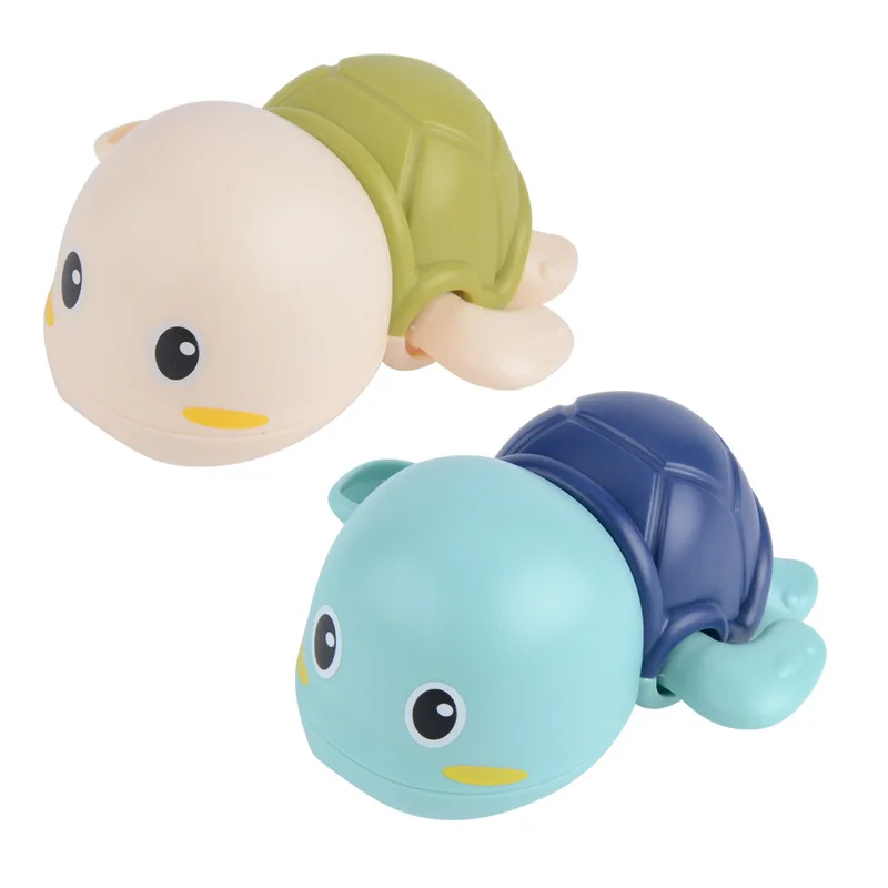 
The baby bathes and plays with the water Little turtle clockwork toy 