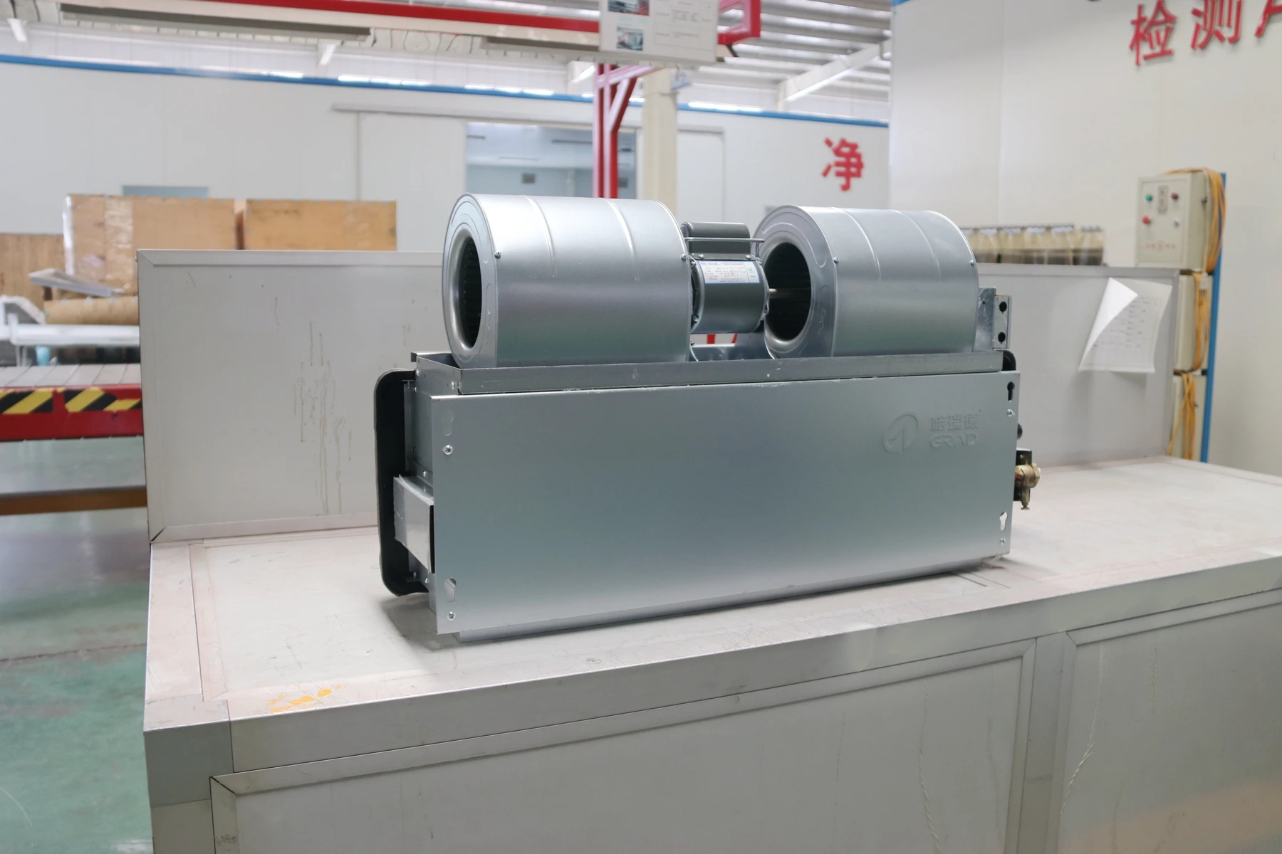 Ceiling mounted heating and cooling fan coil