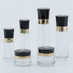 Luxury cosmetic packaging container clear glass packaging bottle with carved cover
