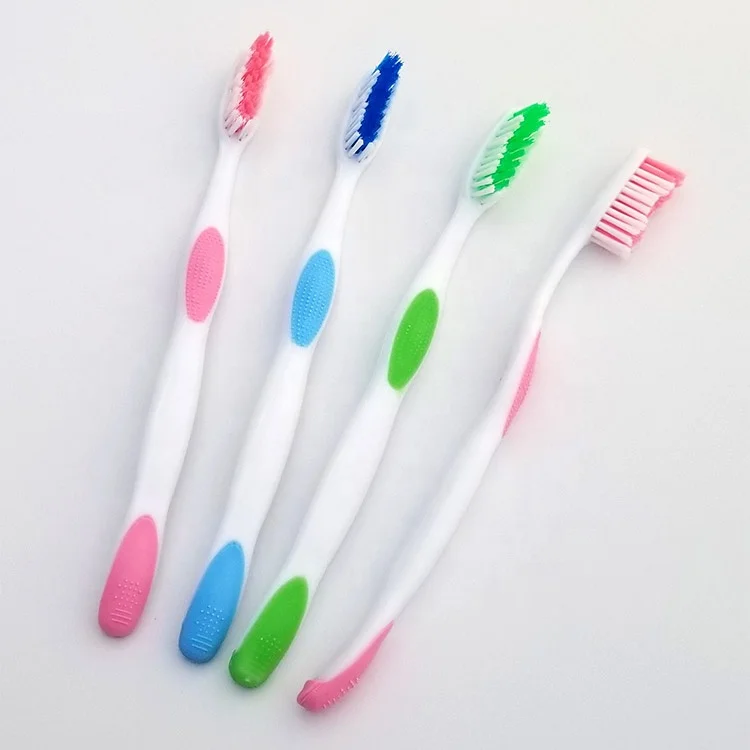 Hard rubber grip adults toothbrush with medium or soft, hard nylon bristle