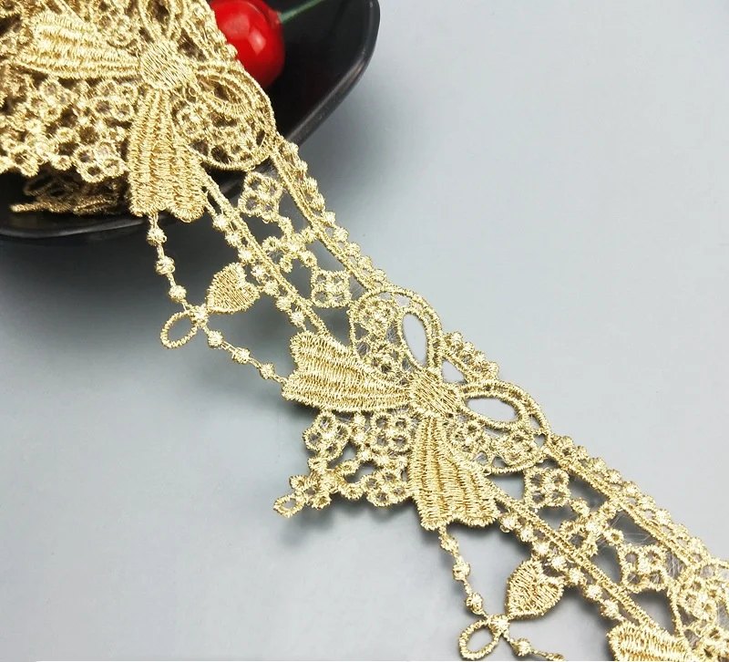 wholesale 5cm polyester golden hollowed out embroidery bow lace trim guipure fabric for wedding dresses garment JDB65
