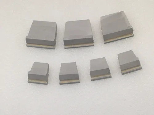 Decanter centrifuge wear tiles with good wear resistance