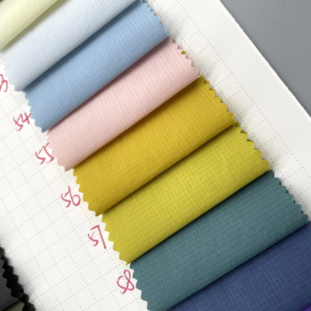 wholesale wrinkle 100% nylon 40D waxing checking ripstop fabric waterproof PU glue coating down jacket windproof fabric for coat