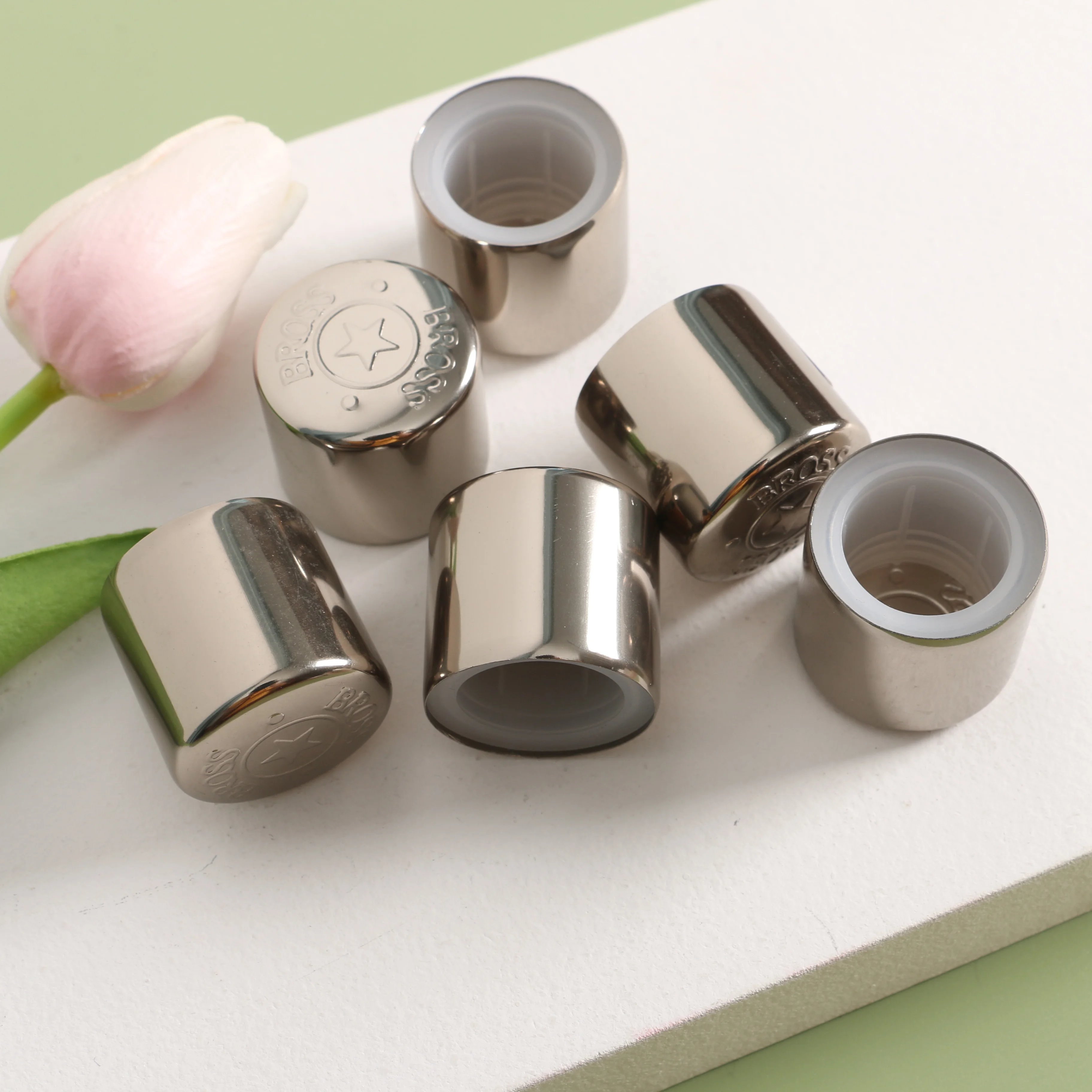 biodegradable pink engraved perfume bottle crock stopper head cap ellipse with global logo bottom cone threaded manufacturer