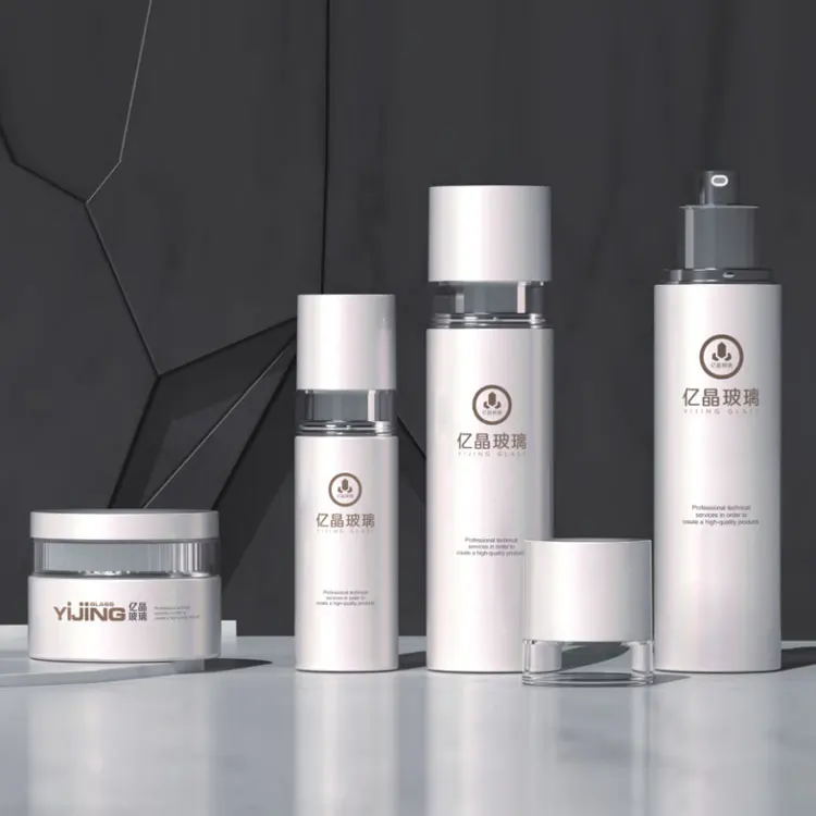 
Popular Design Cosmetic Packaging Set Eye/Face Cream Jar Serum Bottle Custom Skincare Packaging Flat Shouder Round Glass Bottle 