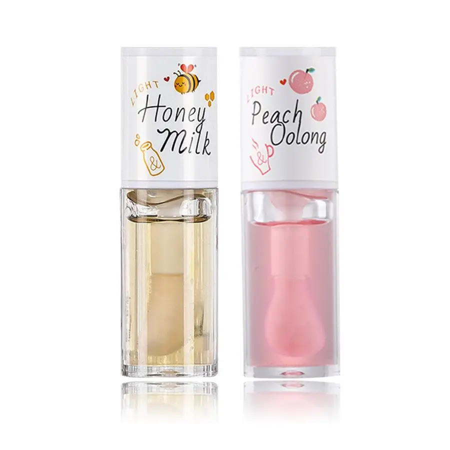 Hot sale plumping lip glaze moisturizing lip plumper fruit fragrance clear magic Lip Oil plumper gloss