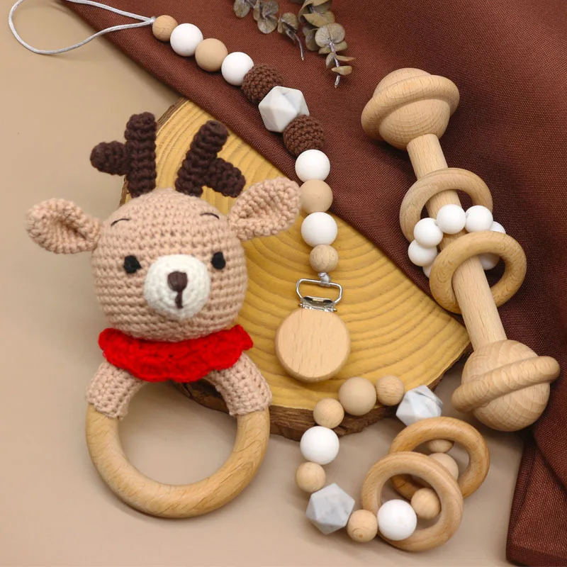 
Wholesale Soft Crochet Deer Wooden Rattle Crochet Wood Silicone Pacifier Clips Baby Teether Bracelet Set 
