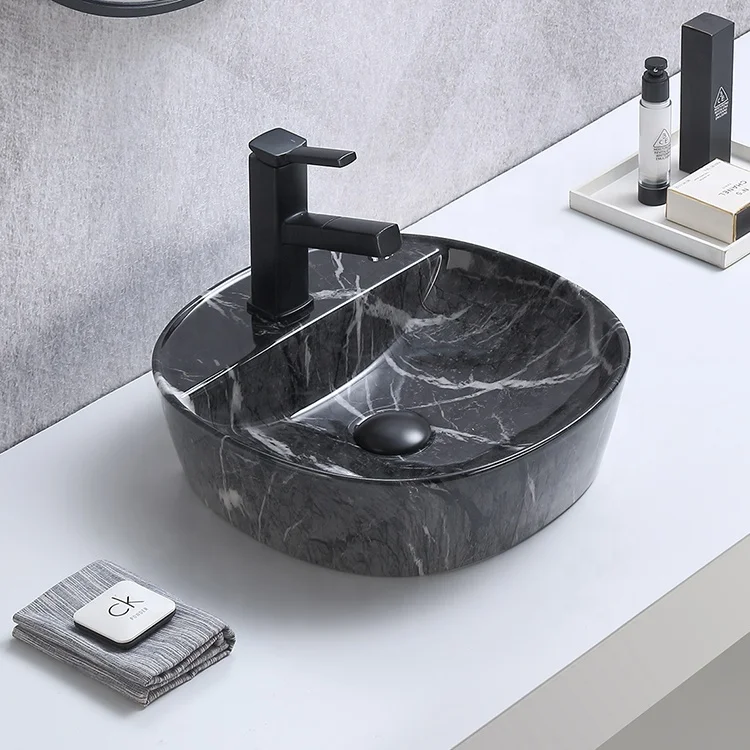 Элегантная настольная художественная раковина с каменным дизайном для ванной комнаты керамическая мраморным узором ручная