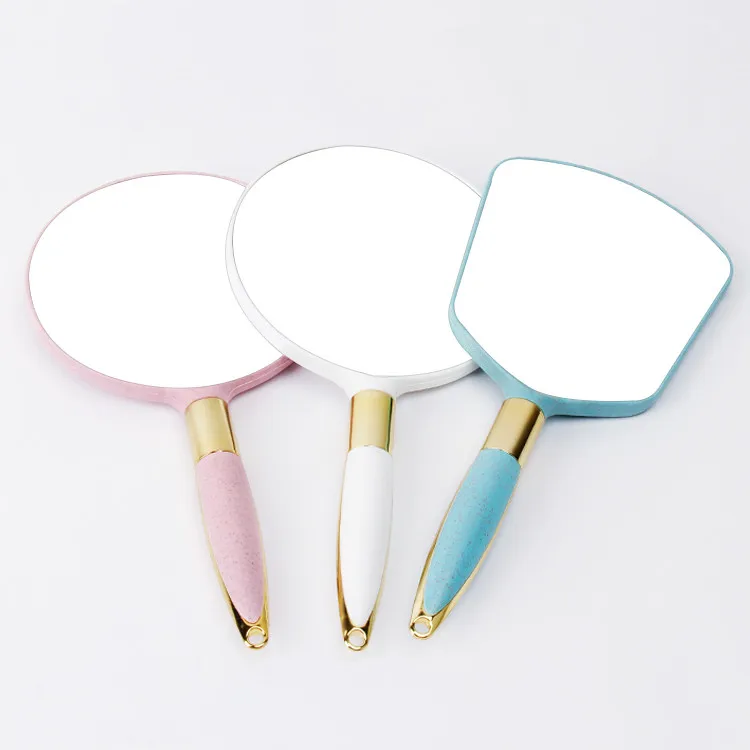 Wholesale creative solid color HD handle cosmetic mirror retro portable beauty handle mirror