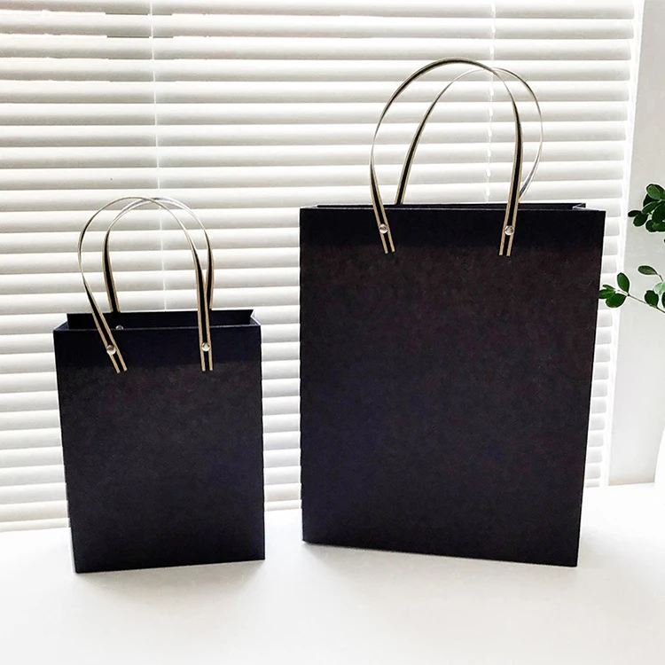 Wholesale high quality printed paper bag shopping bag with rivet and flat handle