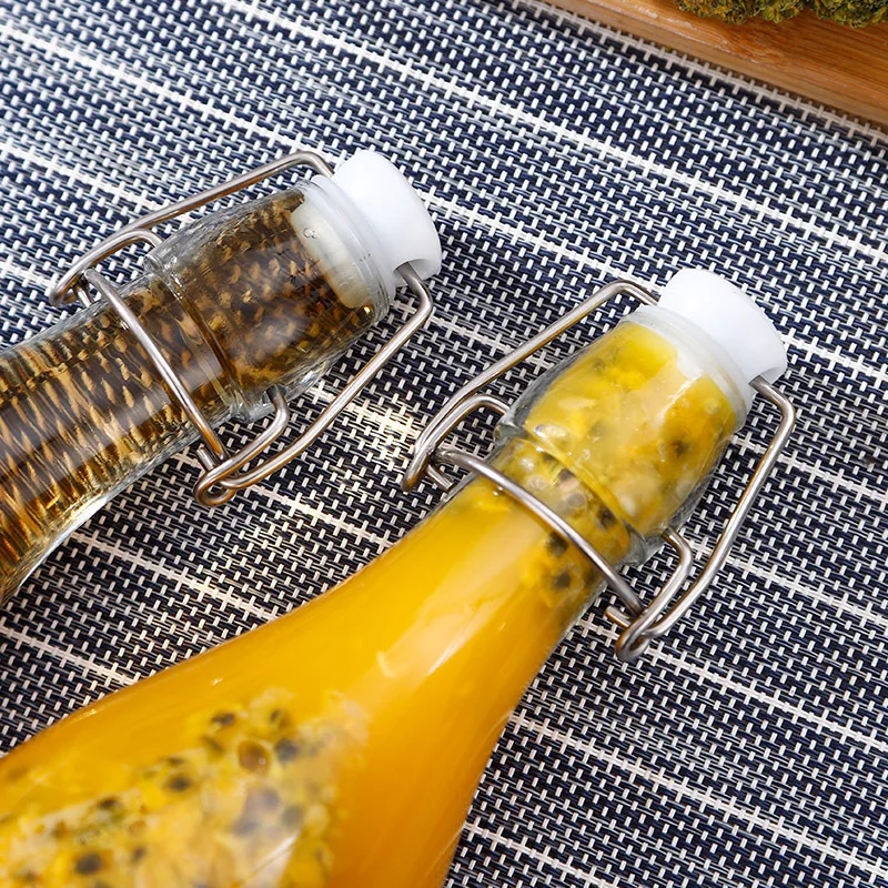 350ml 500ml 1000ml Wholesale Flip Top Transparent Amber Blue Beer Glass Bottle With Swing Caps