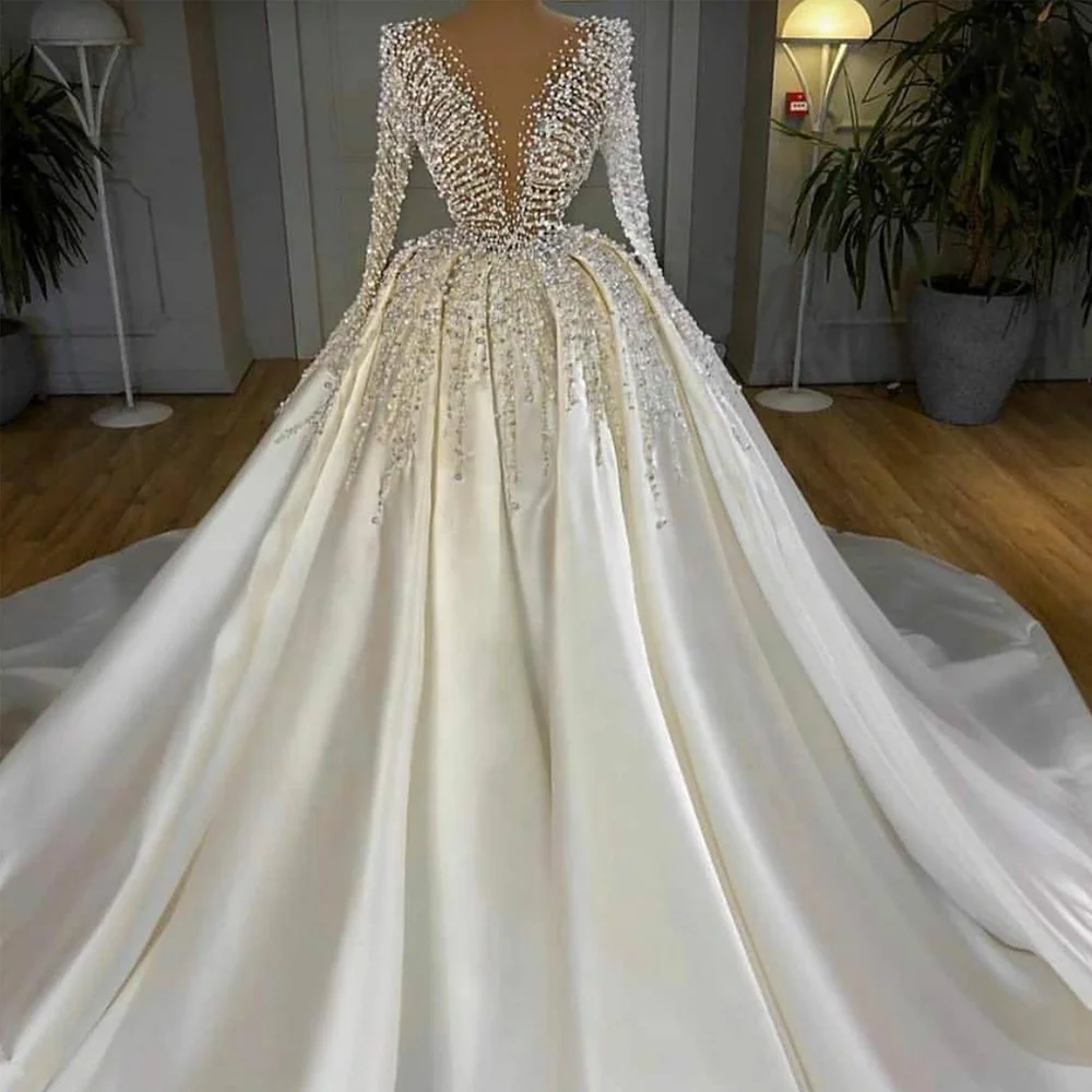 Deep V-neck Long Sleeve Princess Ball Gown Wedding Dress Pearls Beaded Dubai Satin Bridal Gown