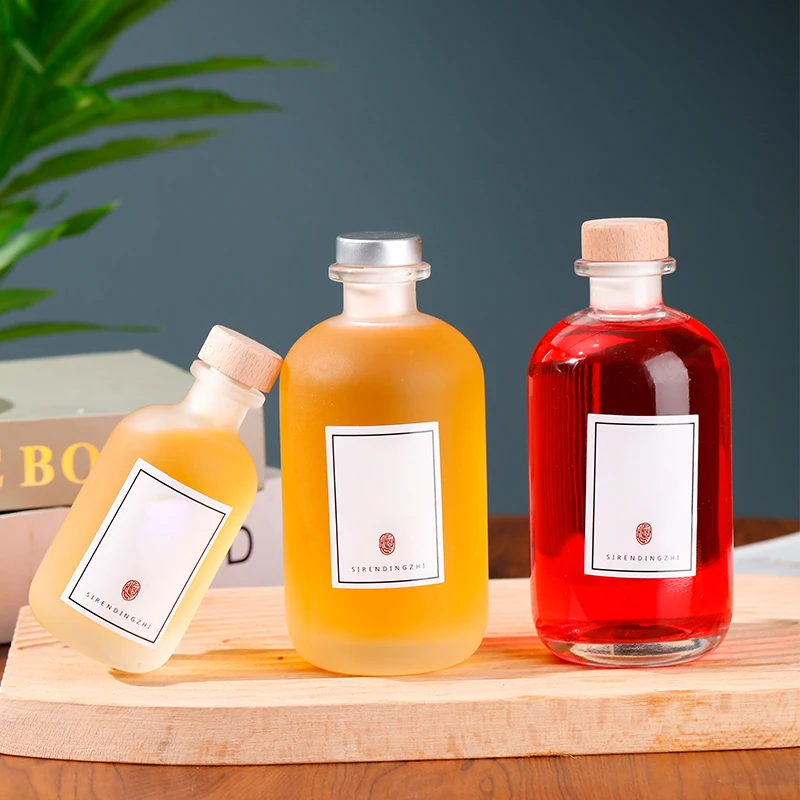 Factory supplied high quality frosting beverage glass bottles 250ml empty glass liquor bottle wine bottles with caps