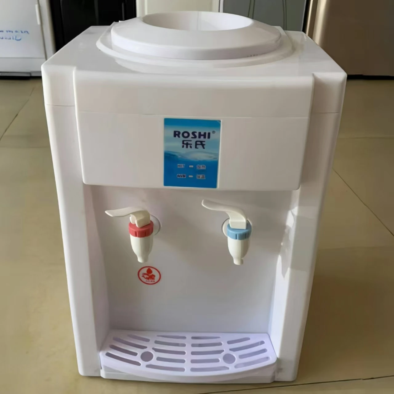 Home vertical bottled water dispenser with cold water at room temperature and hot water