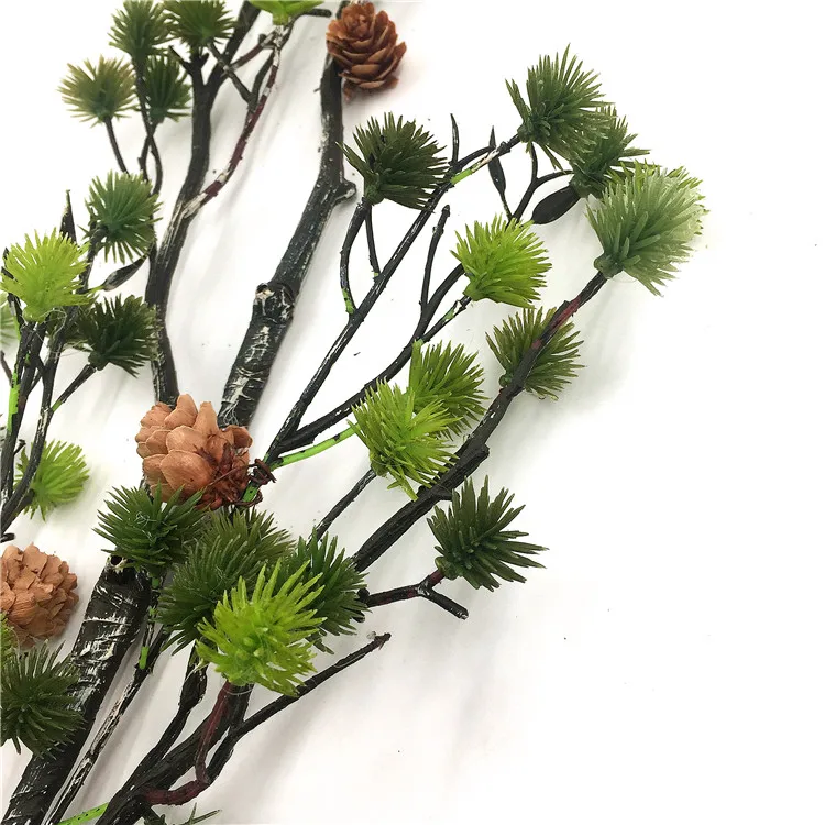 Green pine branches, pinecones, pine stems