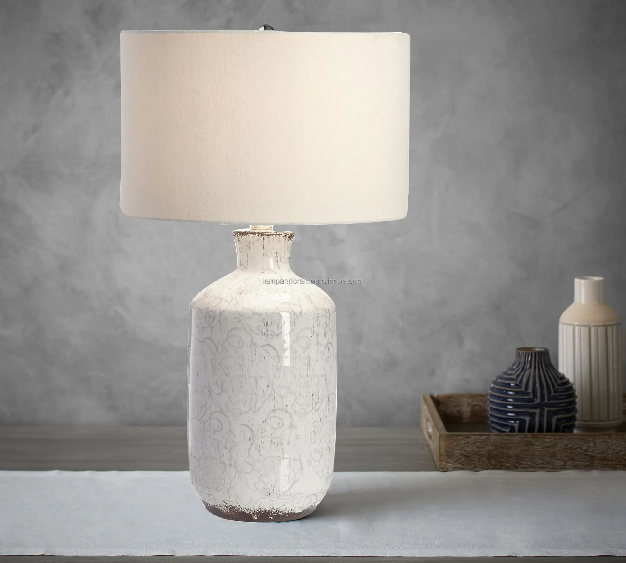 ceramic base table lamp Includes a cream linen drum shade