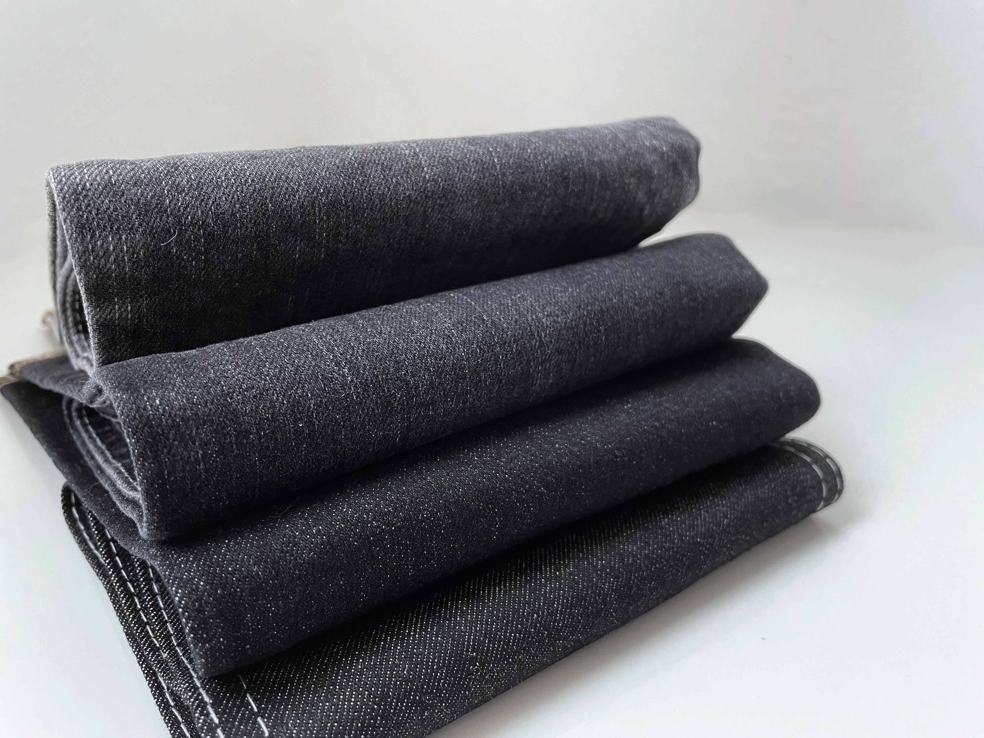 Manufacturer recommended high quality black 10.7oz TR stretch cotton slub denim fabric for jeans