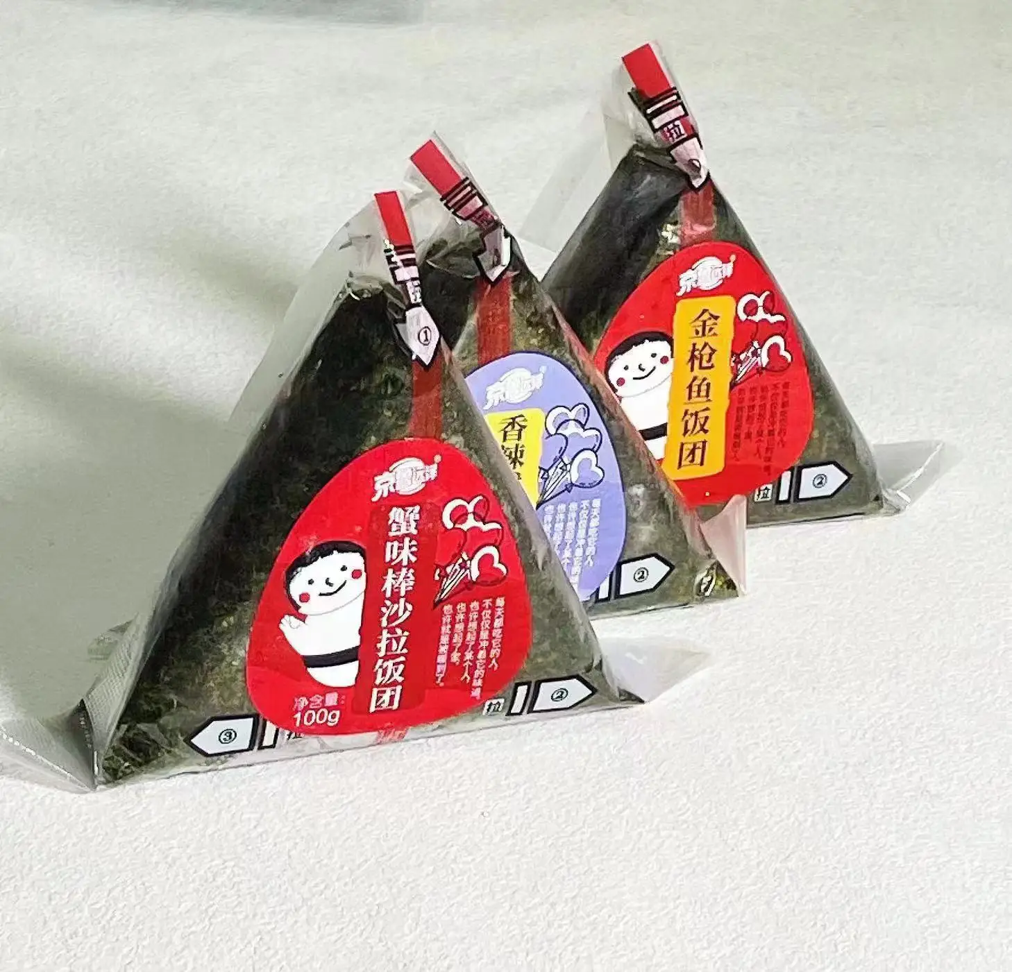 Good quality delicious seafood triangle onigiri squid, crab meat, tuna sushi food