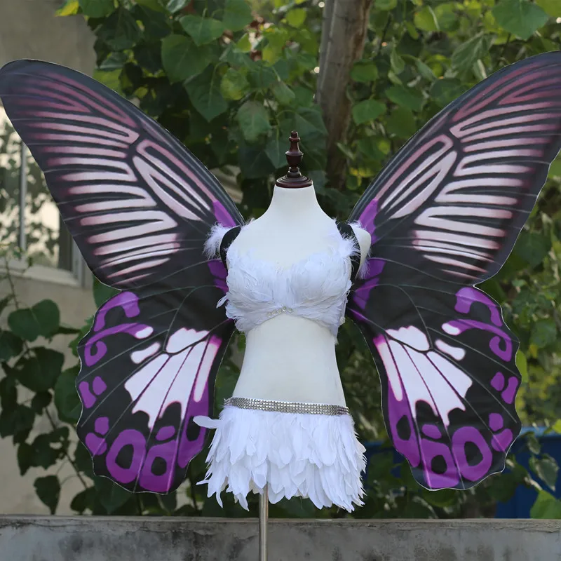 Adult models show large black wings fairy props to perform butterfly wings
