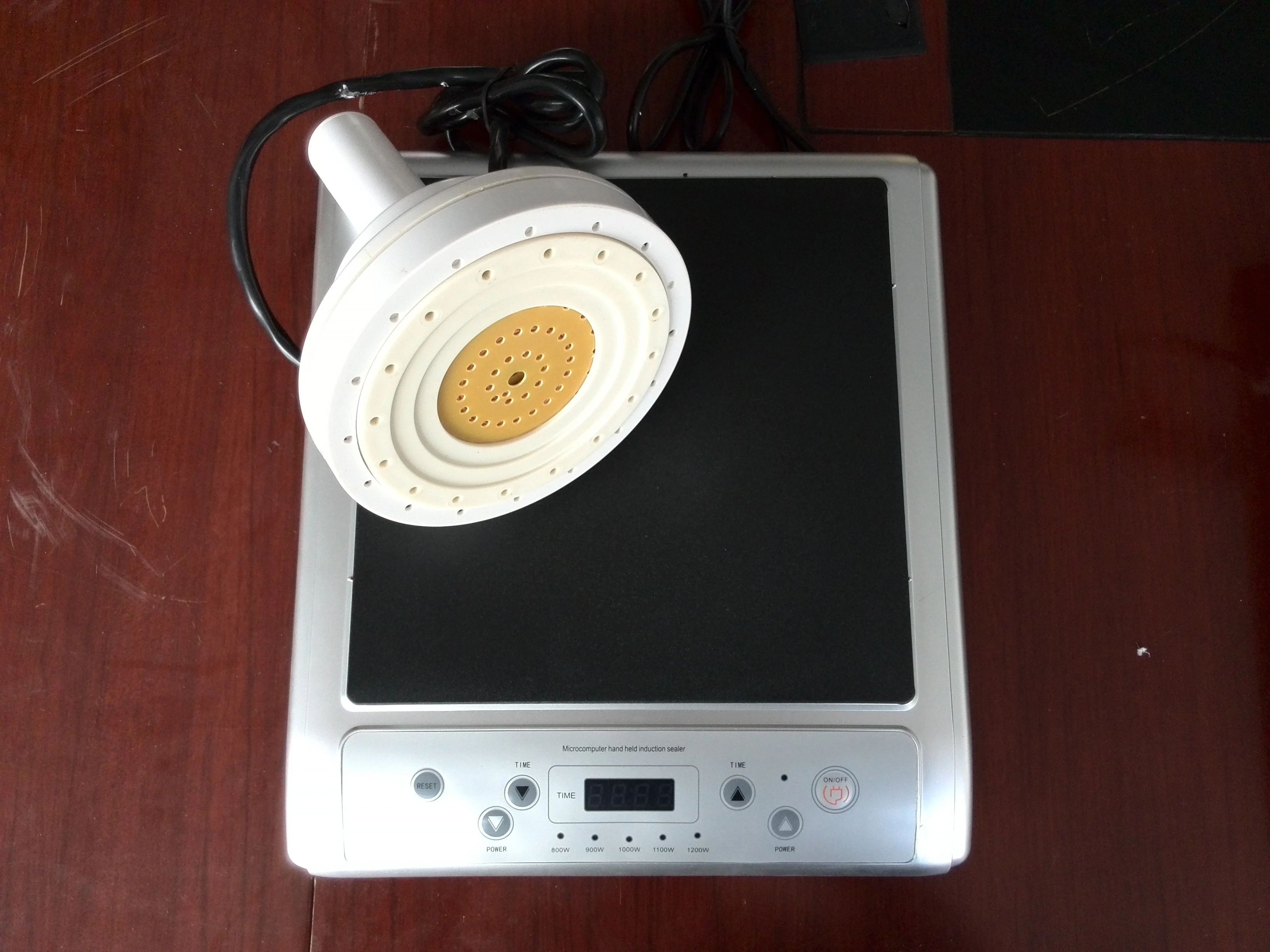 Manual induction aluminum foil plastic cover sealing machine