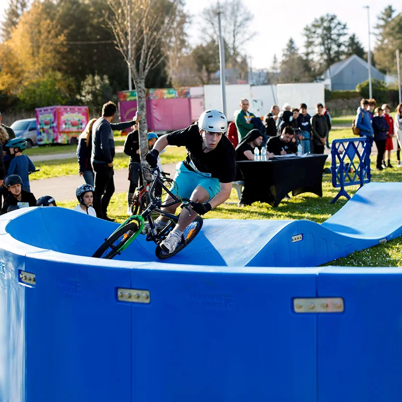 Plastic modular pump track velocity loop 2 is a sequence of roll overs  and berms  for bikes, BMX scooters and skateboards