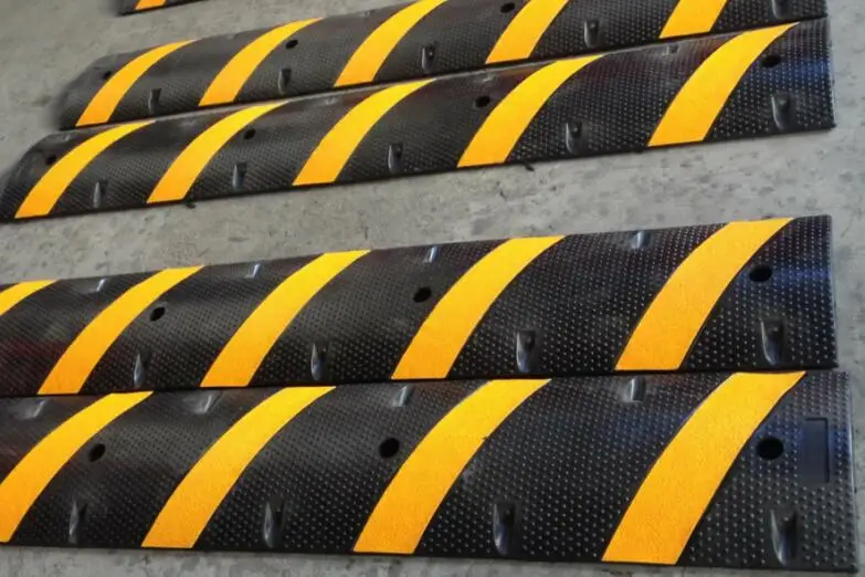 Road safety yellow and black rubber speed breaker hump