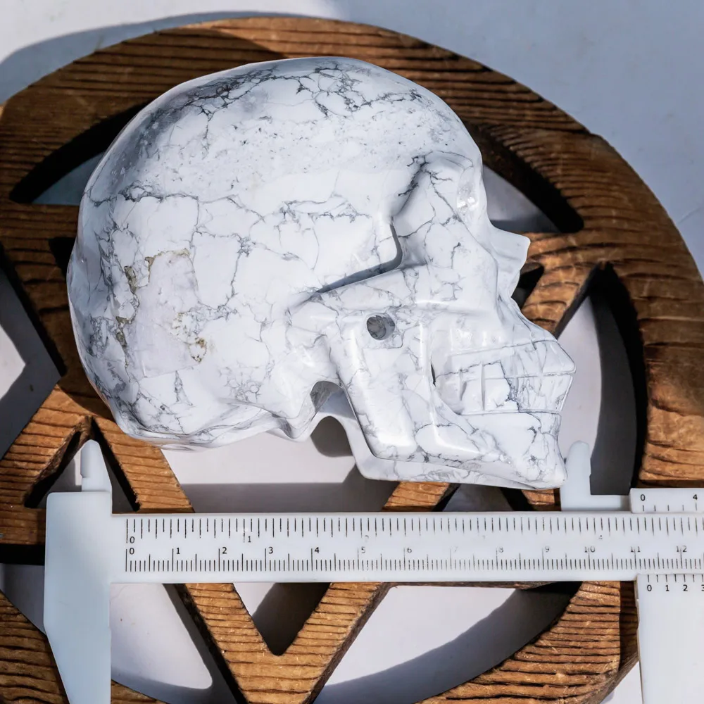 Wholesale Natural Polished Hand Carved Howlite Crystal Hollow Skulls Folk Crafts Healing Stone For Home Decoration