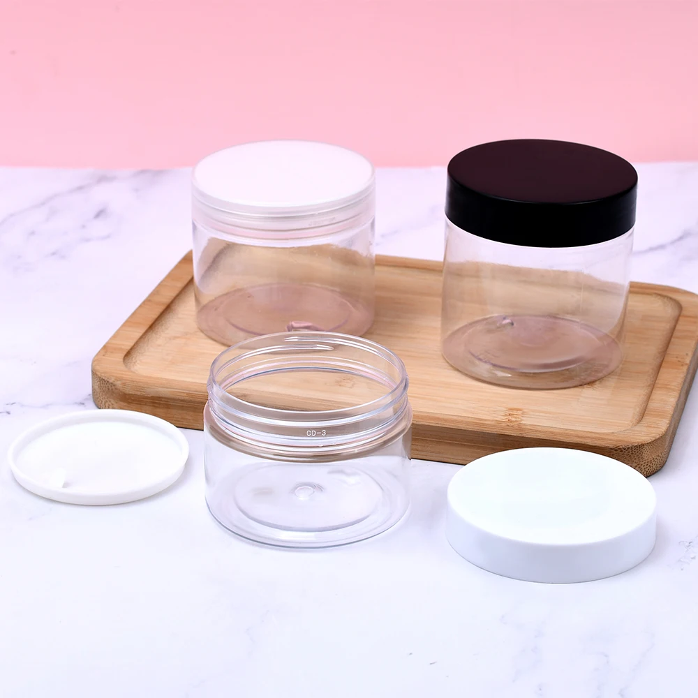 Wholesale high quality 50ml 100ml 200ml 500ml plastic clear face cream food packaging pet products candy jars with lids