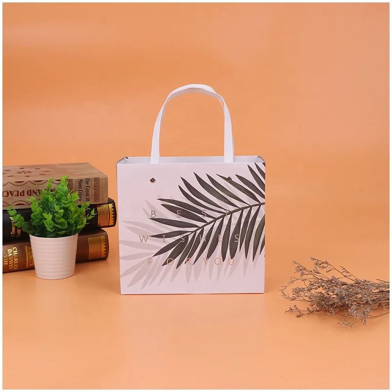 
Creative gifts high-end gift box with hand gift packaging carton custom printed portable box takeout carton 