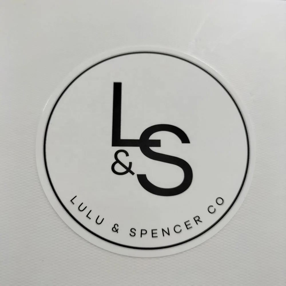 Wholesaler fashion design waterproof paper stickers garment label transparent stickers roll with your own logo