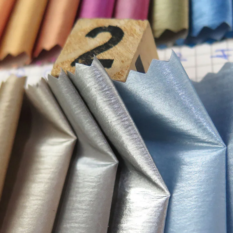 wholesale woven plain style Metallic shiny skin feel anti-static waterproof nylon fabric for coat down jacket, clothes