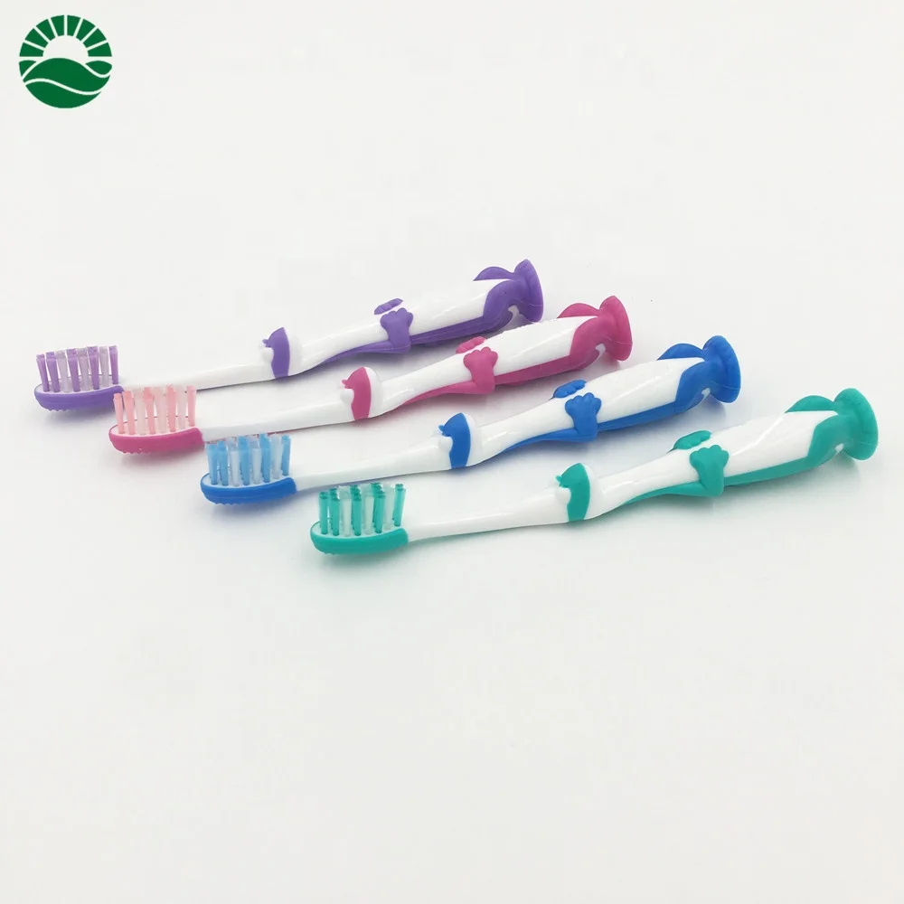 Cute dragon kids personalized toothbrush with suction bottom end round tooth brush