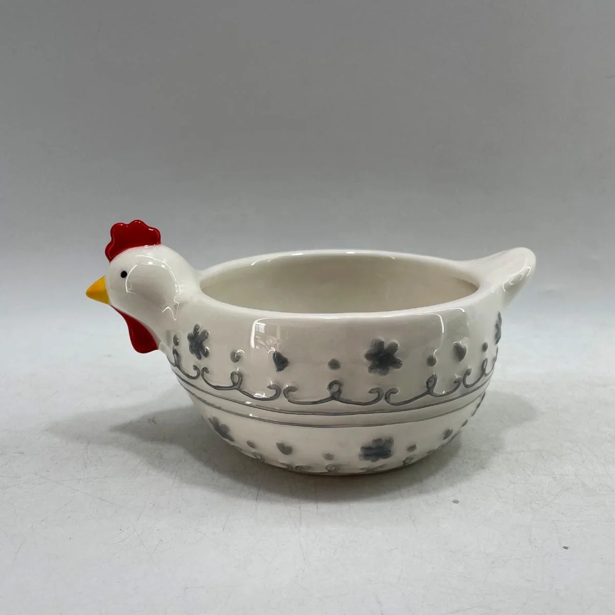 Hand painted ceramic football shaped candy bowl with dog handle
